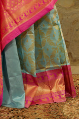 pastel blue soft banarasi pattern saree with woven peacock motifs all over - pink contrast Pallu and border