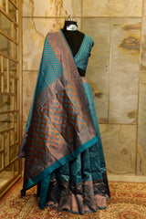 Peacock blue banarasi pattern with copper buttas weaving all over with brocade blouse piece and Pallu