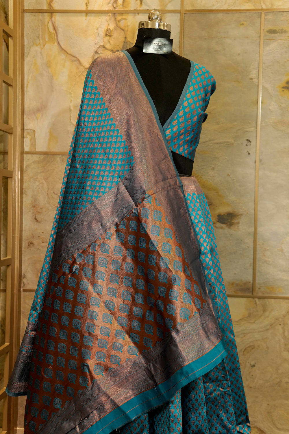 Peacock blue banarasi pattern with copper buttas weaving all over with brocade blouse piece and Pallu