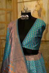 Peacock blue banarasi pattern with copper buttas weaving all over with brocade blouse piece and Pallu