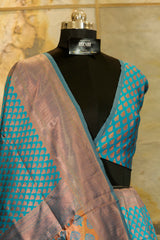 Peacock blue banarasi pattern with copper buttas weaving all over with brocade blouse piece and Pallu